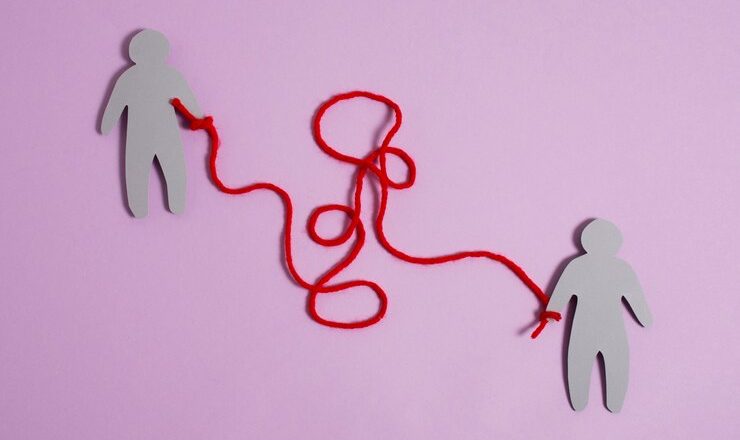 view-red-thread-with-human-figurine_23-2149894051.jpg